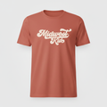 Vintage red t-shirt displayed upright with Midwest Kid retro script graphic in cream on the chest